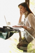 business woman working at laptop (profile) - Alex Mares-Manton