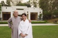 senior couple in front of home - Manoj Adhikari