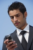 businessman checks his messages (vertical) - Alex Mares-Manton