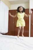 Girl jumping on bed - Manoj Adhikari