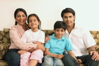 Family on couch - Deepak Budhraja
