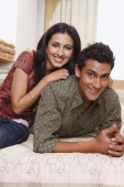 couple lounging on bed - Vivek Sharma