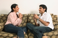 Husband and wife playing cards - Deepak Budhraja