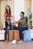 woman showing boyfriend shopping purchases - Vivek Sharma
