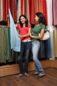 two girls shopping for fabric - Vivek Sharma