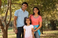 Young family in park - Deepak Budhraja