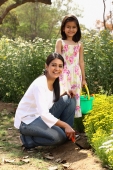 Mother and daughter gardening - Deepak Budhraja