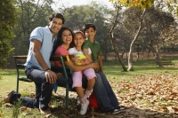 Family of four in park - Deepak Budhraja