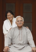 Senior couple in front of door - Manoj Adhikari