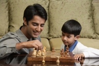 father and son play chess - Alex Mares-Manton