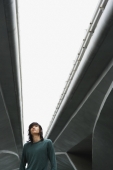young man under freeway overpass - Yukmin