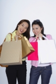 two woman with shopping bags - Yukmin