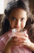 girl holding pink drink, looking at camera - Alex Mares-Manton