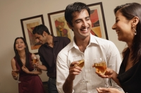 two couples at party, laughing - Alex Mares-Manton