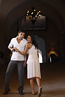couple wearing white, smiling - Vivek Sharma