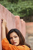 woman leaning against a wall - Vivek Sharma