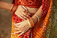 arms of woman wearing bangles - Vivek Sharma