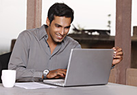 man working at laptop computer - Vivek Sharma