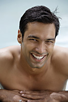 young man in pool with big smile - Alex Mares-Manton