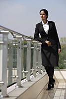 businesswoman on balcony - Alex Mares-Manton