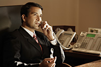 businessman on phone, in office - Alex Mares-Manton