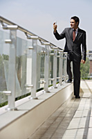 businessman on balcony - Alex Mares-Manton