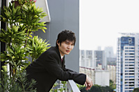 young man in suit at balcony - Yukmin