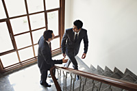 businessmen walking up the stairs - Alex Mares-Manton