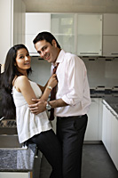 young couple flirting in kitchen - Alex Mares-Manton