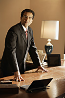 businessman at desk - Alex Mares-Manton