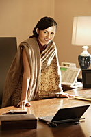 woman in sari, in office - Alex Mares-Manton