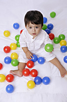 baby boy playing with balls - Alex Mares-Manton