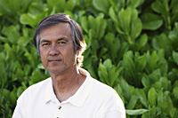 Portrait of mature man, greenery background - Yukmin