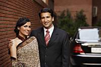 couple in front of car, woman in sari - Alex Mares-Manton