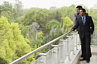 businessmen standing on balcony - Alex Mares-Manton