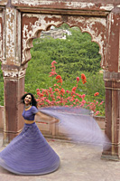 young woman in sari, dancing on terrace - Alex Mares-Manton