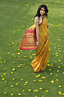 young woman in yellow sari - Alex Mares-Manton