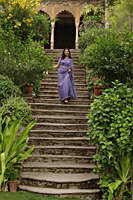 young woman in sari walking down the stairs - Alex Mares-Manton
