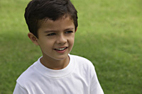 Little boy in white tee shirt, at park - Vivek Sharma