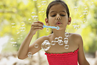 little girl blowing bubbles - Vivek Sharma