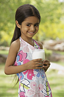 little girl with glass of milk - Vivek Sharma