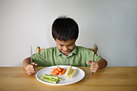 Little boy with plate of vegetables - Yukmin