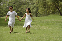 kids running in park, holding hands - Alex Mares-Manton