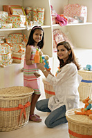 mother and daughter in toy store - Alex Mares-Manton