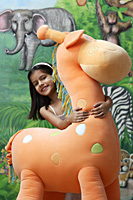 little girl with big stuffed giraffe - Alex Mares-Manton