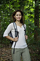 Woman with backpack in the woods - Yukmin