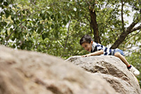 boy climbing on rocks - Alex Mares-Manton