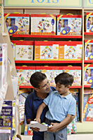 father and son in toy store - Alex Mares-Manton