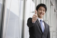 Businessman giving "thumbs up" sign - Yukmin