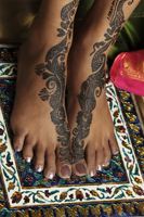 woman's feet painted with henna - Vivek Sharma